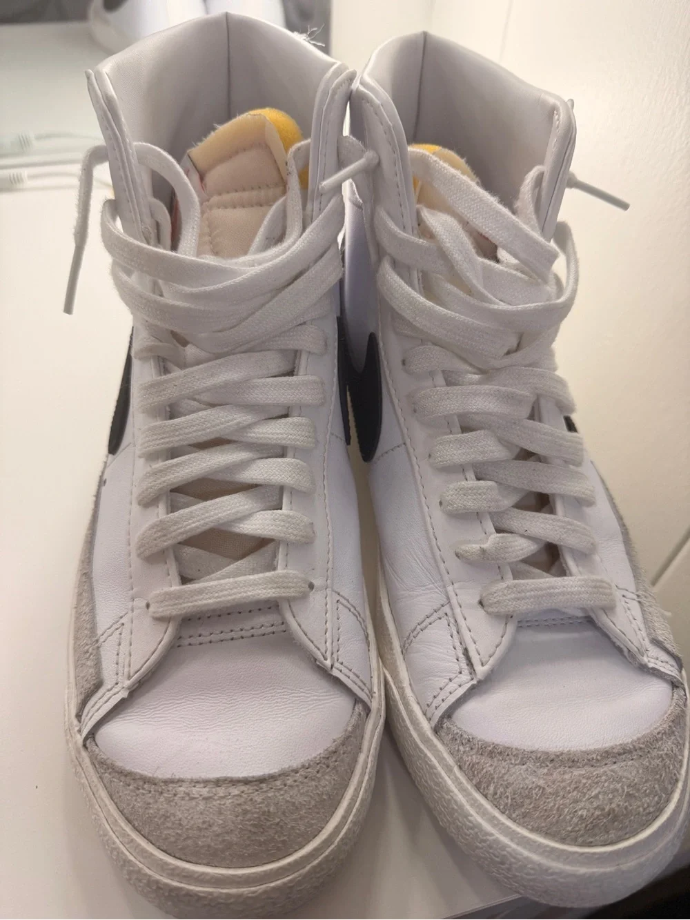 Nike White Sneakers with Black Swoosh